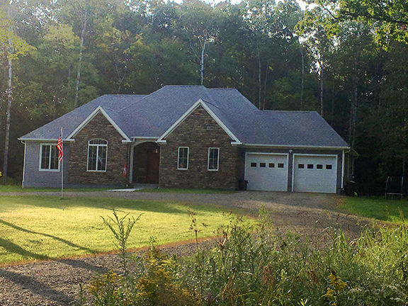 Pictured is the 54th house that Alfred State students have built for the Wellsville community.