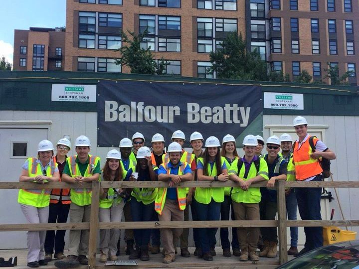 Alfred State Intern at Balfour Beatty, many people standing outside wearing hard helmets and yellow safety vests